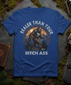 Bigfoot graphic with runes and text "Realer Than Your Bitch Ass" on a blue t-shirt