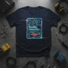 Dark navy t-shirt featuring a neon blue and orange circuit board design with "Reality Distortion" text, representing a guitar pedal