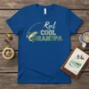 Reel Cool Grandpa t-shirt with a fish jumping on a fishing line and the text "Reel COOL GRANDPA"