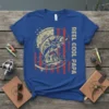 Reel Cool Papa text and bass fish jumping with American flag background on a blue t-shirt