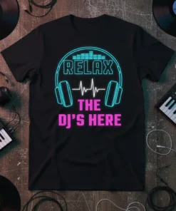 Black t-shirt with "RELAX THE DJ'S HERE" text in neon blue and pink, featuring headphones and a sound wave graphic