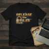 Black t-shirt with "RELEASE the FILES" text and a golden lock graphic with circuit board elements