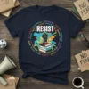 Navy t-shirt with the word RESIST in bold white letters, surrounded by various social justice issues and a graphic of