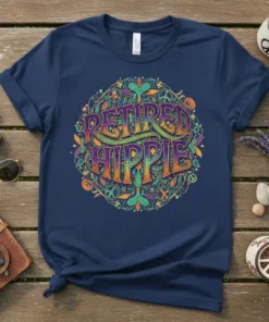 Navy blue t-shirt with "Retired Hippie" text in colorful, groovy font surrounded by peace symbols and floral ornaments
