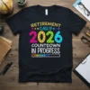 Retirement Class of 2026 Countdown In Progress text design with colorful numbers and a progress bar on a black t-shirt