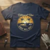 Retirement Plan Golf All Day quote on a navy t-shirt with a circular golf scene graphic, including palm trees and