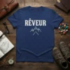Navy t-shirt with white text "Rêveur" and minimalist mountain graphic, perfect for dreamer and adventurer apparel