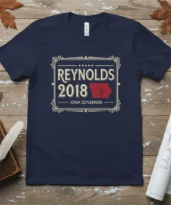 Navy t-shirt featuring "REYNOLDS 2018 IOWA GOVERNOR" text and an outline of Iowa map graphic