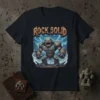 Rock Solid T-Shirt featuring a powerful, cartoonish rock monster with glowing orange cracks, standing amidst a stormy, lightning-filled sky