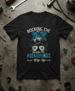 Rocking The Mechanic Wife Life quote with leopard print bow and mechanic tools graphic on a black t-shirt