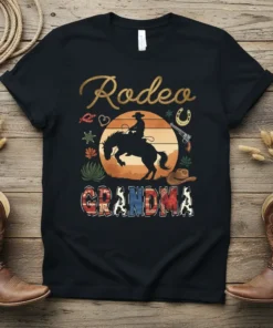 Rodeo Grandma t-shirt with a silhouette of a cowboy riding a horse against a sunset and western-themed graphics