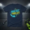 Runner T-Shirt with bold blue and yellow text "RUN FAST. TURN LEFT." and graphic arrow, designed for marathon training