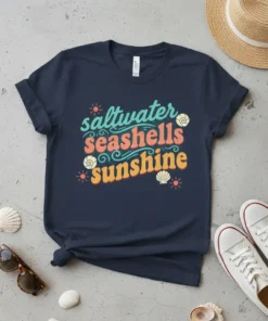 Saltwater Seashells Sunshine t-shirt with vintage-inspired typography and beach motifs