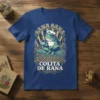 Sana Sana Colita De Rana text with a nurse frog illustration on a blue t-shirt