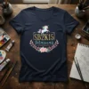 SB2K15 Mamas text with a unicorn and floral wreath design on a navy blue V-neck t-shirt