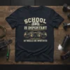 School Is Important But Muscles Are Importanter t-shirt with dumbbells and open book graphic