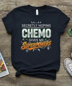 Secretly Hoping Chemo Gives Me Superpowers quote on a navy t-shirt, featuring bold typography and graphic elements