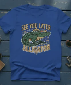 See You Later Alligator text with a cool alligator wearing rainbow sunglasses on a blue t-shirt