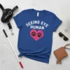 Seeing Eye Human t-shirt with white text and pink heart graphic with paw prints