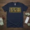 She Got A Ring I Got This Shirt text design with gold chain border on a navy t-shirt