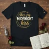 Black t-shirt with "she's my MIDENIGHT kiss" text design in gold and white, framed by a crescent moon graphic and