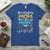 Blue t-shirt design with "She's not just my MOM She's also my FAVORITE Nurse" text, heartbeat line, cross, and syringe