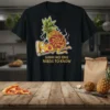 Funny "Shhh No One Needs To Know" text with cartoon pizza and pineapple characters on a black t-shirt