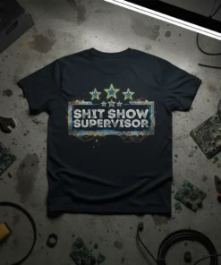 Shit Show Supervisor text design with stars and distressed frame on a black t-shirt