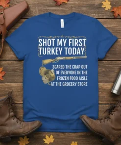 Funny Thanksgiving t-shirt with text "Shot My First Turkey Today" and graphics of a turkey and rifle