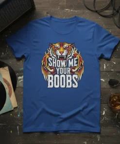 Show Me Your Boobs text with a roaring tiger and wings graphic on a blue t-shirt