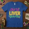 Shut Up LIVER You're Fine funny drinking quote t-shirt with yellow, pink, and green text and Mardi Gras confetti