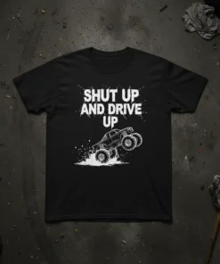 Black t-shirt with white text "Shut Up And Drive Up" and a graphic of a monster truck kicking up dirt