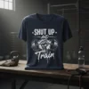 Shut Up And Train t-shirt with a vintage distressed barbell graphic and motivational quote for gym workouts