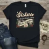 Sisters are like fat thighs.. they they Stick Together quote on a black t-shirt with decorative banner and hearts