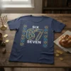 Navy blue t-shirt with "SIX 67 SEVEN" design featuring Hanukkah symbols like menorahs and Star of David