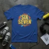 Blue t-shirt with "SIX SEVEN" in bold gold cracked font, surrounded by orange and teal graffiti-style splatters and lines