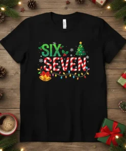 Black t-shirt with "SIX SEVEN" in festive Christmas font, candy cane style, surrounded by holiday lights, bells, and a Christmas