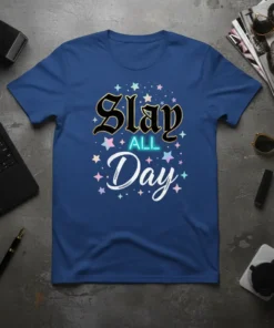Blue t-shirt with "Slay ALL Day" text in gothic and neon fonts, surrounded by colorful stars