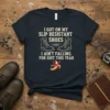 T-shirt with text "I Got On My Slip Resistant Shoes I Ain't Falling For Shit This Year" and graphic of