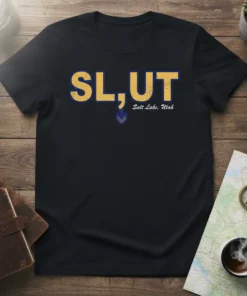 Black t-shirt with yellow and blue text "SL,UT Salt Lake, Utah" and a small colorful graphic below