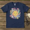 Smiling sun with rainbow swirls and colorful flowers graphic on a navy blue t-shirt, primary keyword Smiling Sun Rainbow