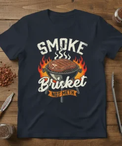 SMOKE Brisket NOT METH text with graphic of brisket on a grill surrounded by flames, navy t-shirt