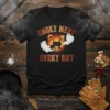 Smoke Meat Every Day t-shirt with graphic of grill and smoking meat, featuring fire and tongs