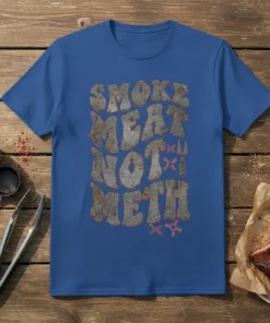 T-shirt with "Smoke Meat Not Meth" text in distressed metal font, featuring BBQ grill tools and chemical symbols