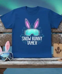 Snow Bunny Tamer text design with bunny ears and ski goggles on a blue t-shirt