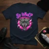 So What? text above a fierce leopard head graphic with green eyes and pink lightning bolts on a navy t-shirt