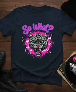 So What? text above a fierce leopard head graphic with green eyes and pink lightning bolts on a navy t-shirt