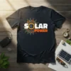 SOLAR POWER text design with a stylized sun graphic, featuring white and orange lettering on a dark t-shirt