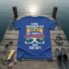 T-shirt with white text "SOME GRANDPAS TAKE NAPS" and "THEN TAKE NAPS" framing "REAL GRANDPAS GO JET SKIING" with graphics