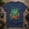 Minnesota outline map with "Some One in Minnesota LOVES ME" text and floral accents on a navy blue t-shirt